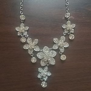 Silver necklace with flower shaped designs